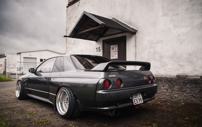 Nissan Skyline R32 in Stance Style Near Old House