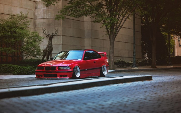 Red BMW E36 Stance Car on Urban Street