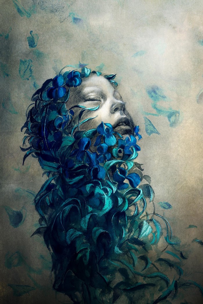 Woman's face covered in blue flowers