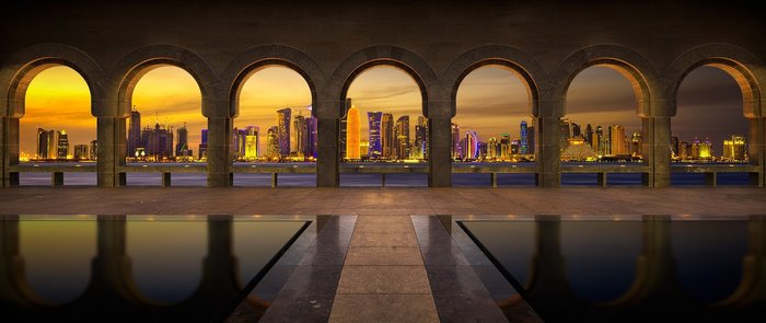 Doha skyline viewed through Islamic Art Museum arches