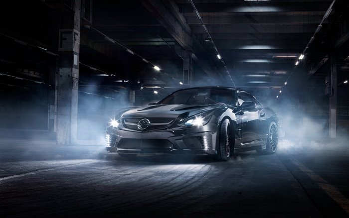 Black Mercedes-Benz AMG GT in smoky garage