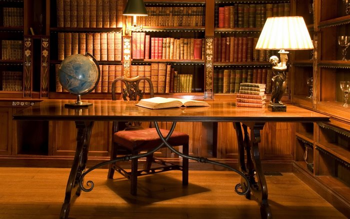 Library interior with desk and bookshelves