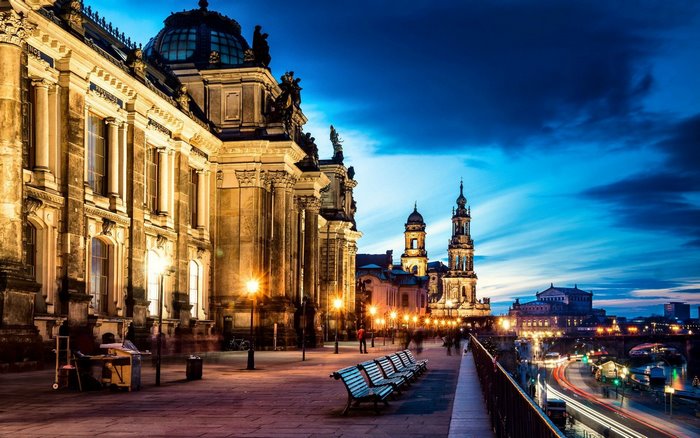 Dresden cityscape at dusk with illuminated buildings and river