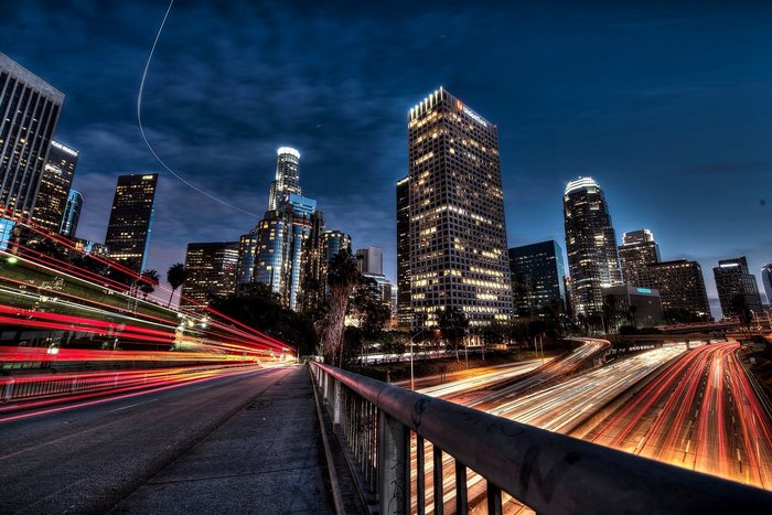 Los Angeles cityscape at night with light trails