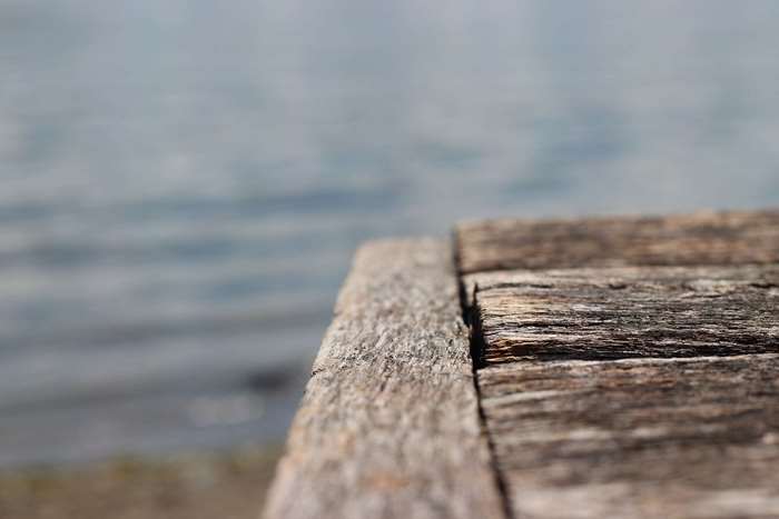 Wooden table by the water