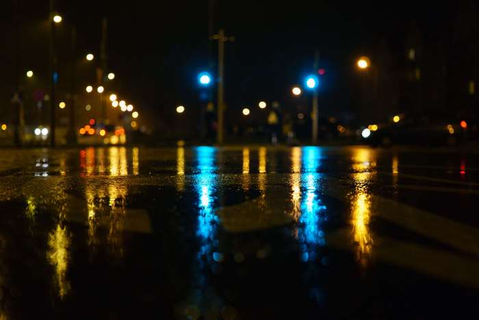 Night street with wet asphalt and reflections of lights