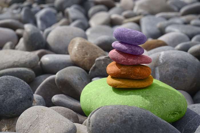 Stack of colorful stones on a beach