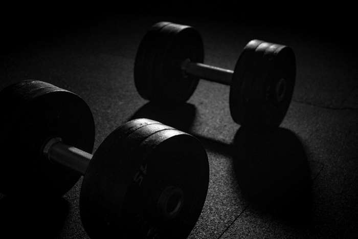 Dumbbells on a dark floor