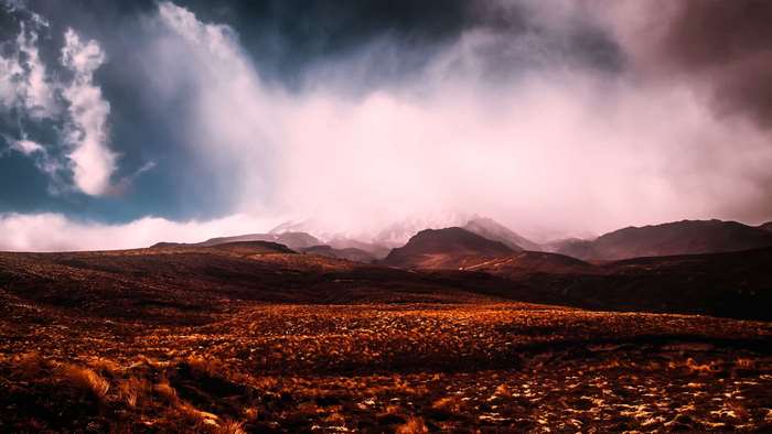 Dramatic clouds over a mountainous landscape in New Zealand