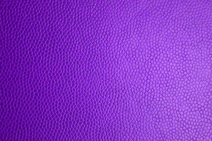 Purple textured leather material surface