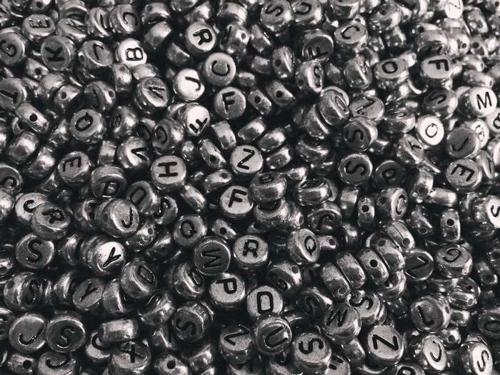 Pile of silver alphabet beads