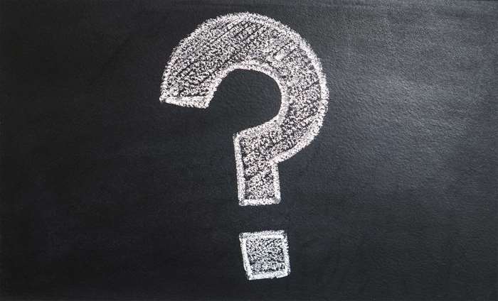 Question mark drawn with chalk on a blackboard