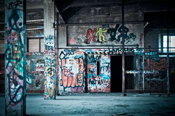 Graffiti-covered abandoned building interior