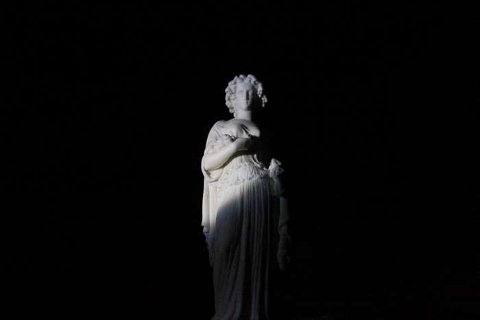 Statue in dramatic lighting