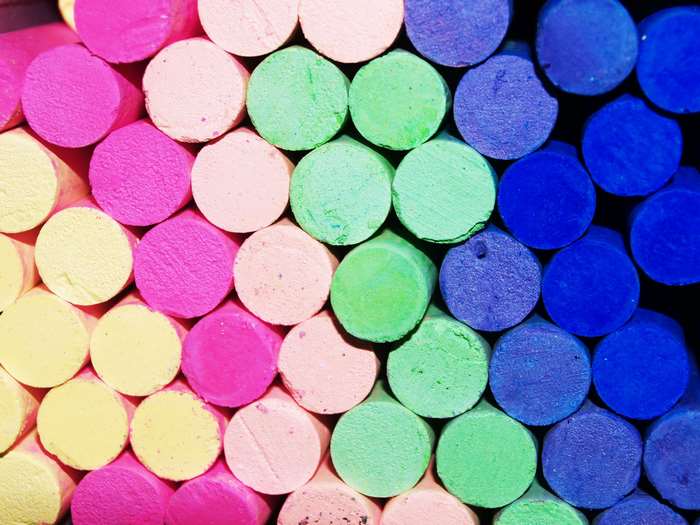 Close-up of colorful chalk sticks arranged in rows