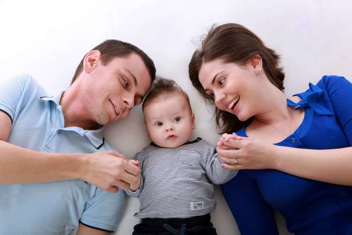 Family with Baby Lying Down