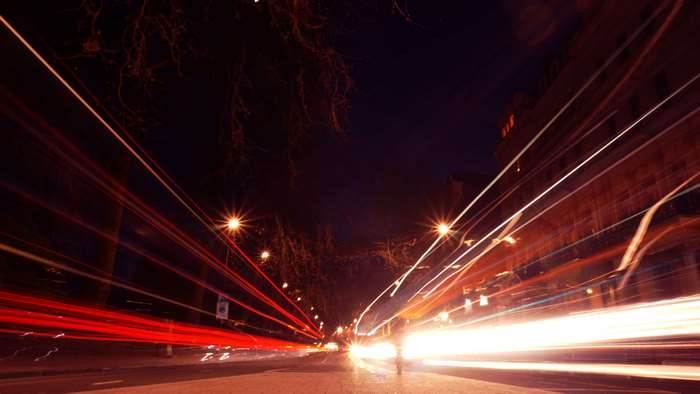Long exposure of city street at night with light trails