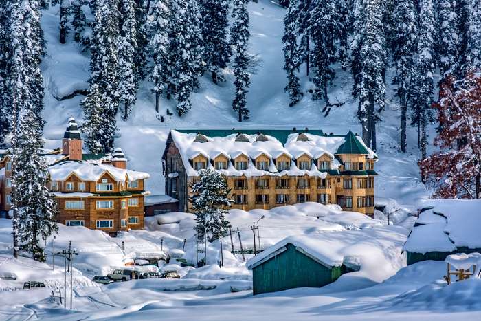 Snow-Covered Buildings Amid Gulmarg Himalayas 4K