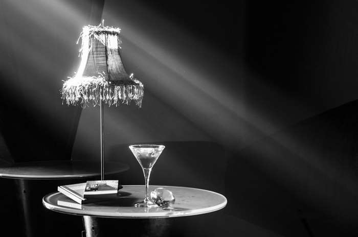 Black and white image of a lamp and a martini
