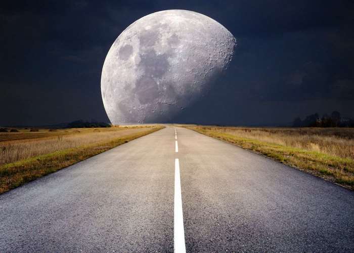 Moonlit Road Leading Into a Gigantic Half Moon