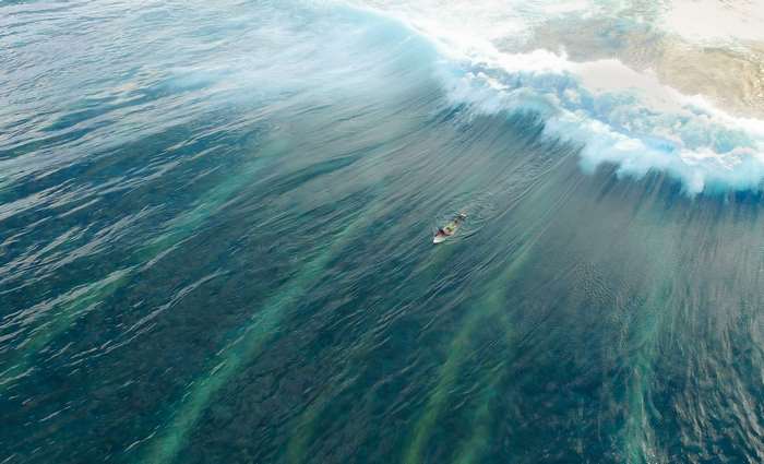 Surfer on a large wave in the ocean