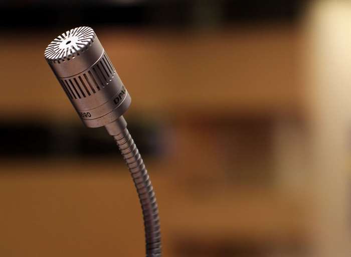 Close-up of a DPA microphone on a gooseneck stand