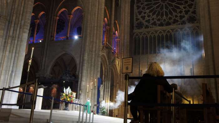 Incense smoke inside Notre Dame Cathedral at night
