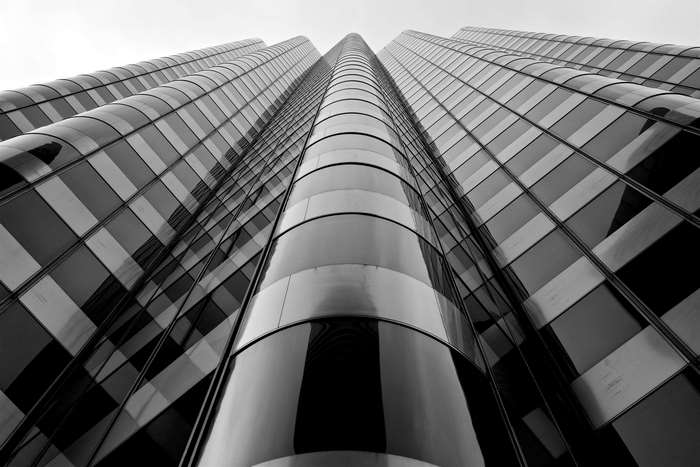 Modern glass skyscraper viewed from below
