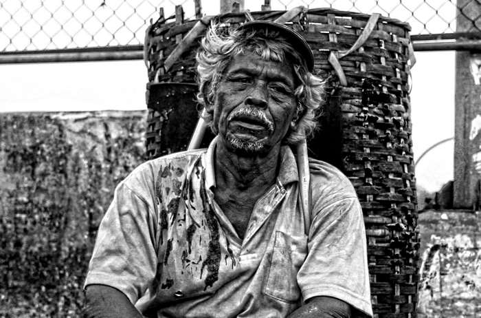 Black and white portrait of a tired worker