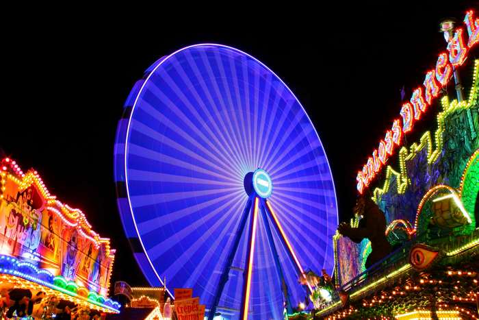 Ferris wheel and carnival rides at night 4K