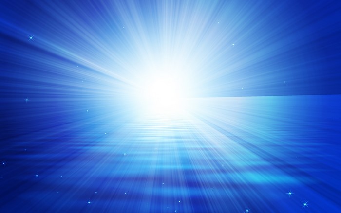 Blue light rays shining over water with sparkles