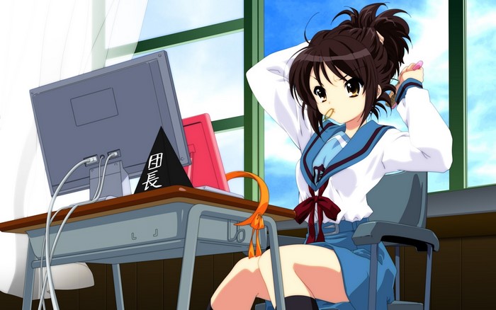 Girl with computer in a classroom