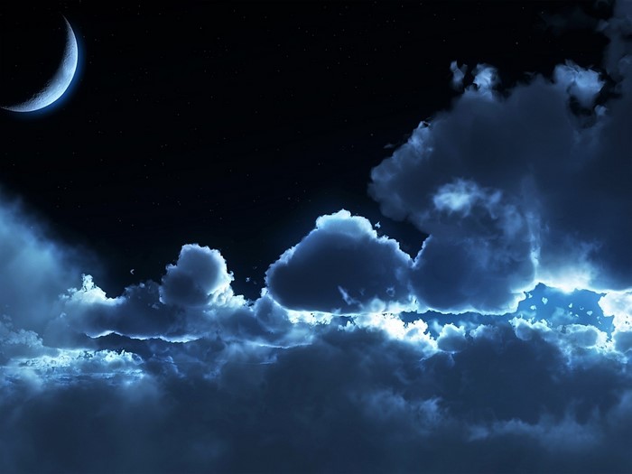 Night sky with crescent moon and clouds