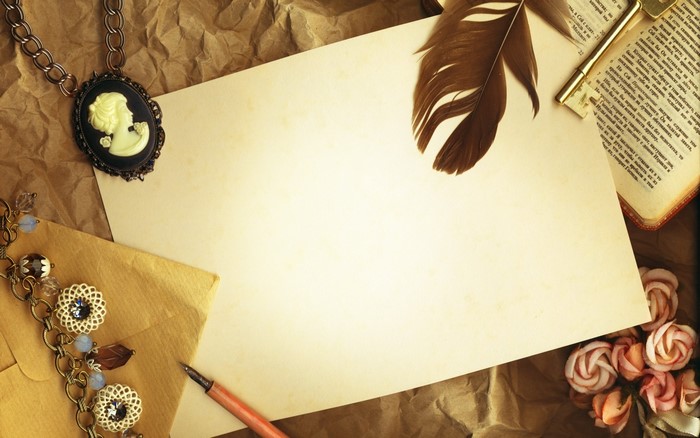 Vintage paper with cameo, key, pen, book, and flowers