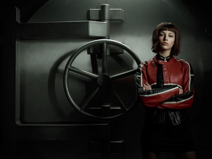 La Casa de Papel Character in Front of Safe Door
