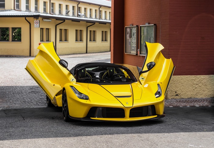 Yellow Ferrari LaFerrari with doors open
