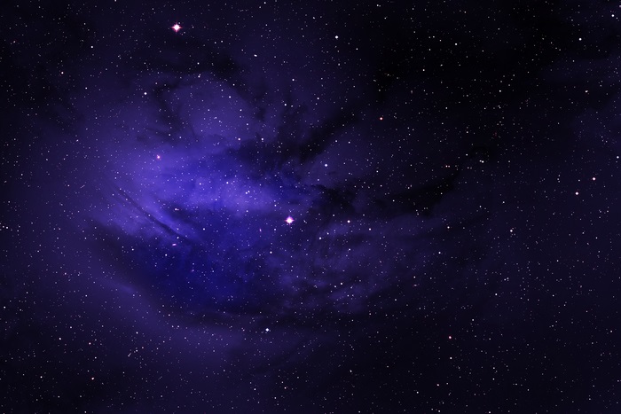 Purple nebula with stars in deep space