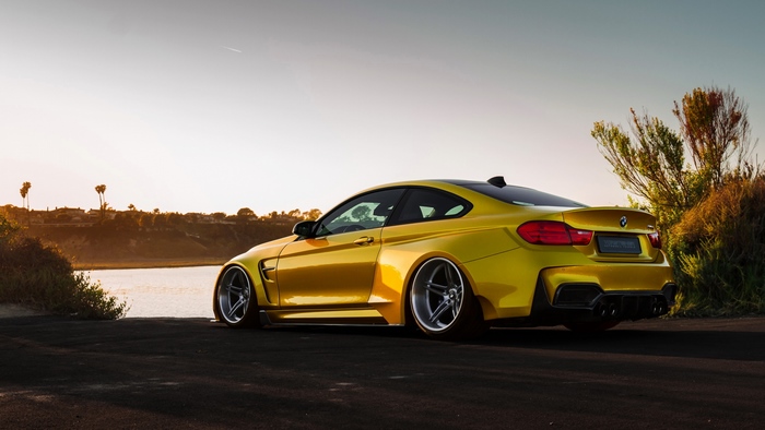 Yellow BMW M4 Coupe by the Water