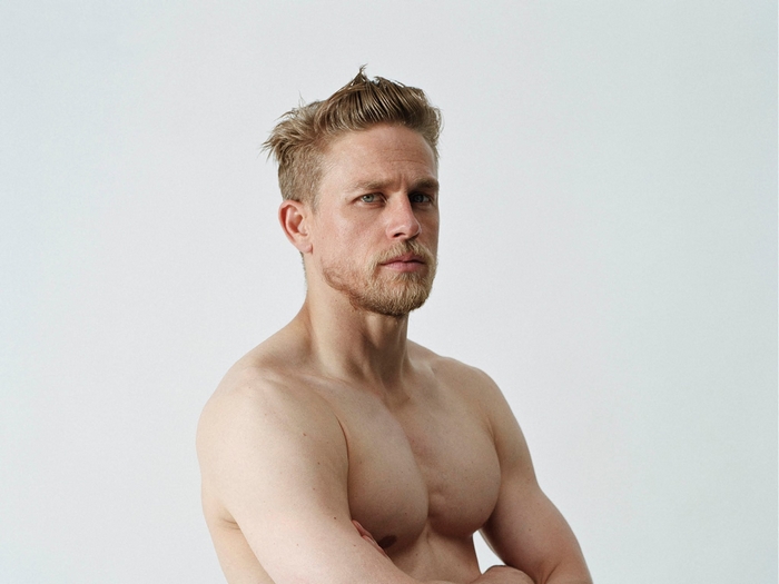 Charlie Hunnam shirtless with arms crossed