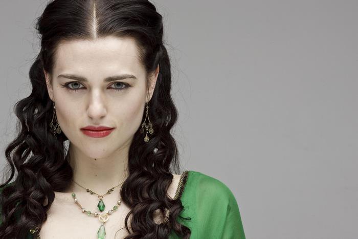 Katie McGrath with long black hair and green dress