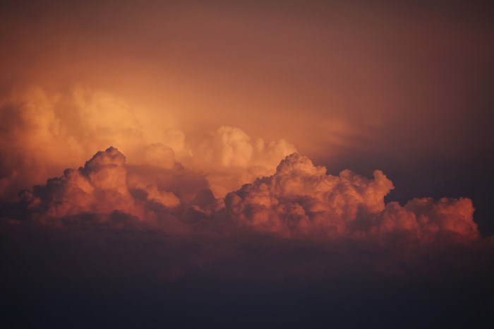 Dramatic sunset sky with orange clouds