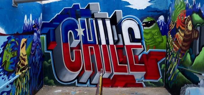 Graffiti art of "CHILE" with Chilean flag and birds