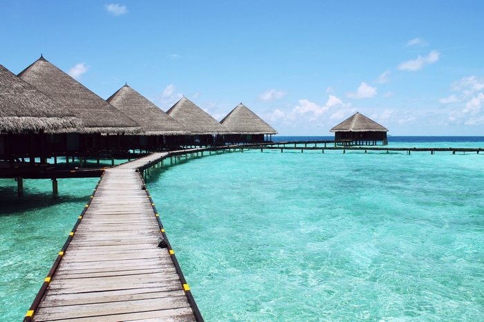 Overwater bungalows on a turquoise lagoon