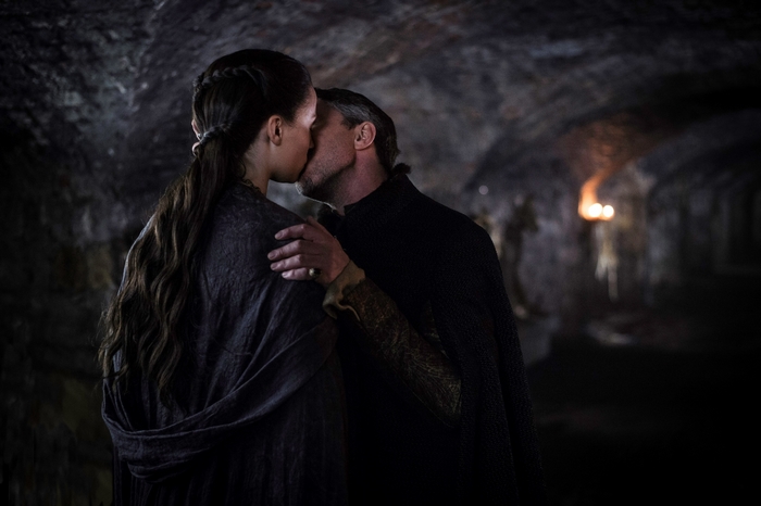 Couple kissing in a dark tunnel