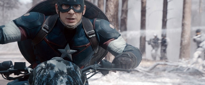 Captain America on a motorcycle in a snowy forest