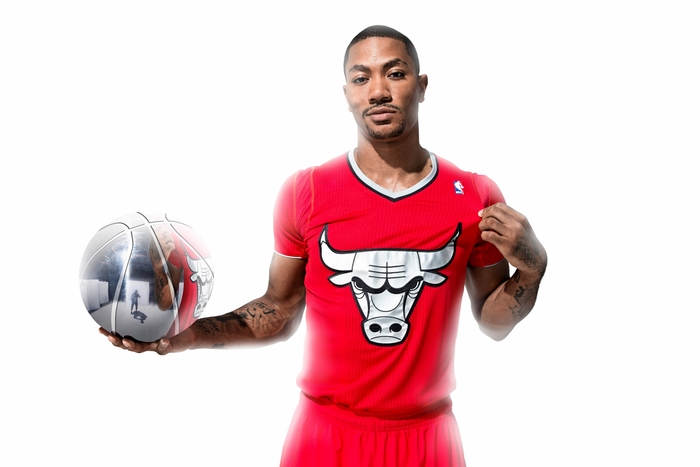 Derrick Rose in Chicago Bulls uniform holding a basketball