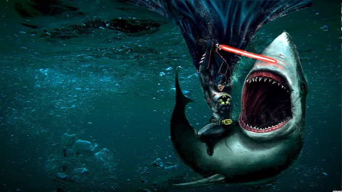 Batman fighting a shark with a lightsaber underwater