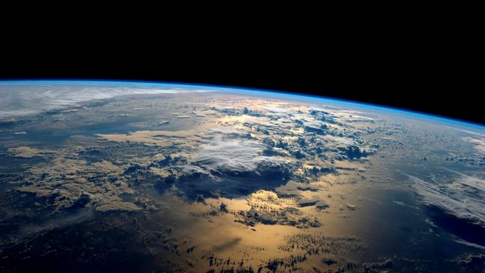 Earth from space with clouds and atmosphere