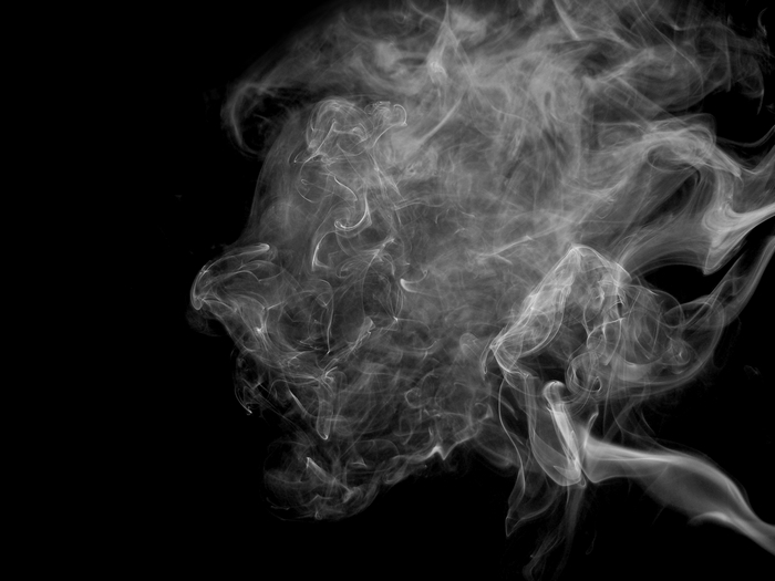 Smoke swirling against a black background