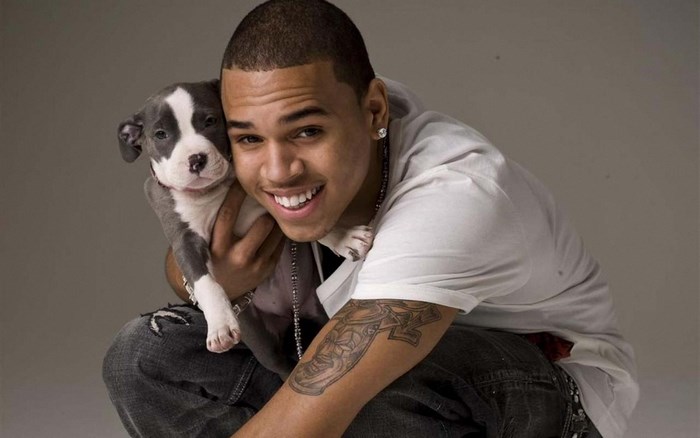 Chris Brown holding a puppy